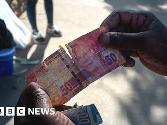 Buying banknotes to survive Zimbabwe's sky-high inflation